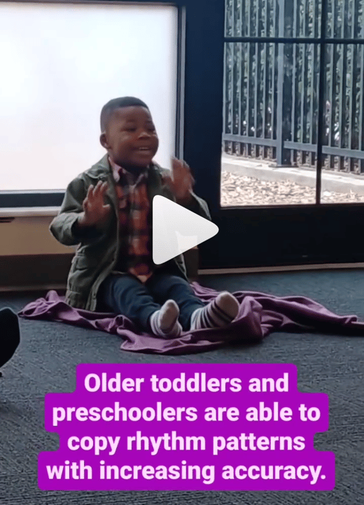 3-year-old boy practices pattern recognition in a Kindermusik class.